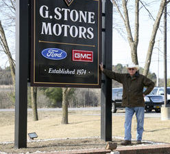 Gardner Stone of Family Trade by his G-Stone Motors sign (Source: GSN)