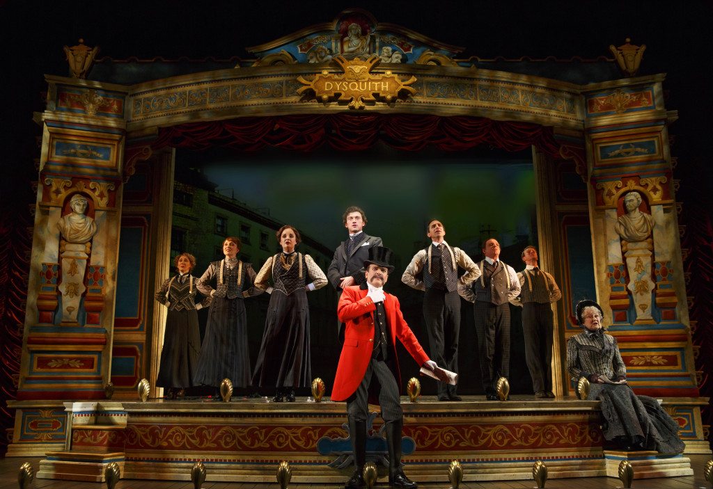 The cast with Bryce Pinkham as Monty Navarro (standing center), Jefferson Mays as Lord Adalbert D