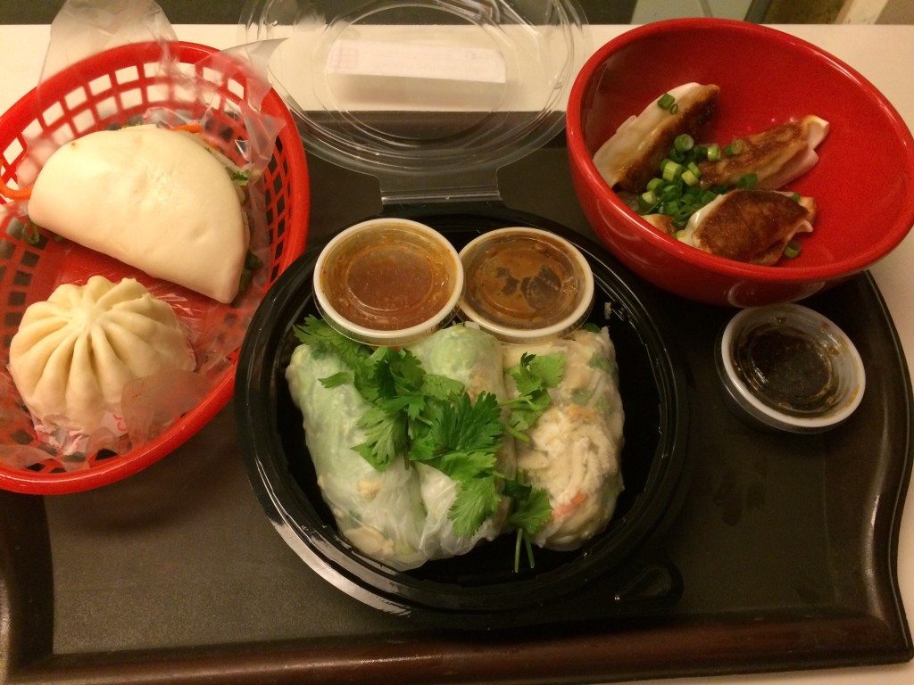 (L-R) Pork belly bao (top), sweet coconut custard bao (bootom) Chicken summer rolls w/ Spicy Peanut dipping sauce. Chicken potstickers w/ scallions. Photo courtesy of Ryan Leeds